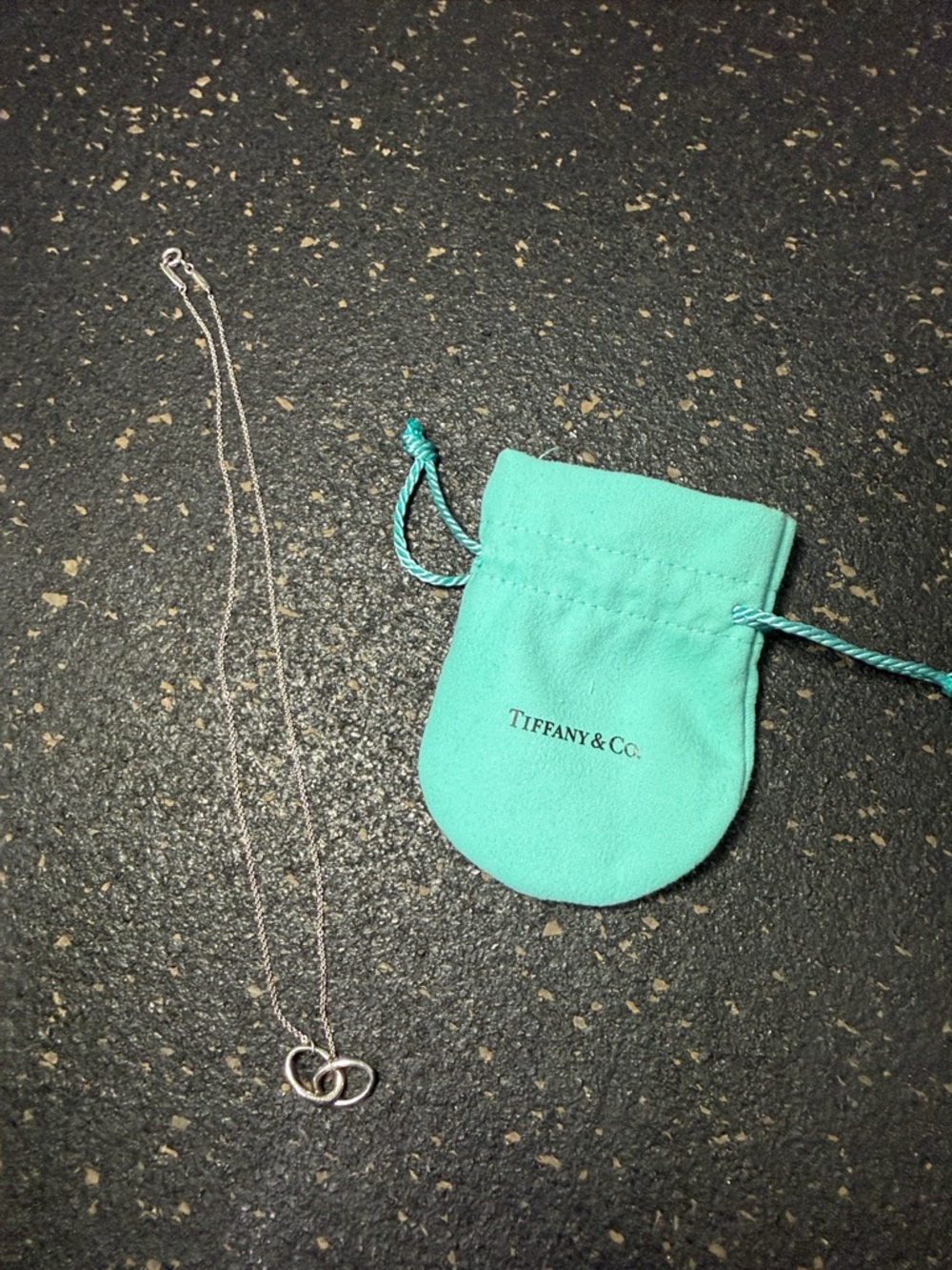 Tiffany & Co. Silver Interlocking Heart Necklace with Signature Blue Pouch